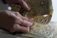 Canadian $100 bills are counted in Toronto, Feb. 2, 2016. A survey released last month by Co-operators, a Canadian financial services provider, found that just one-quarter of Canadians aged 18 to 44 feel confident in their ability to choose investment opportunities, while 38 per cent said they don't know everything they need about their investing options.