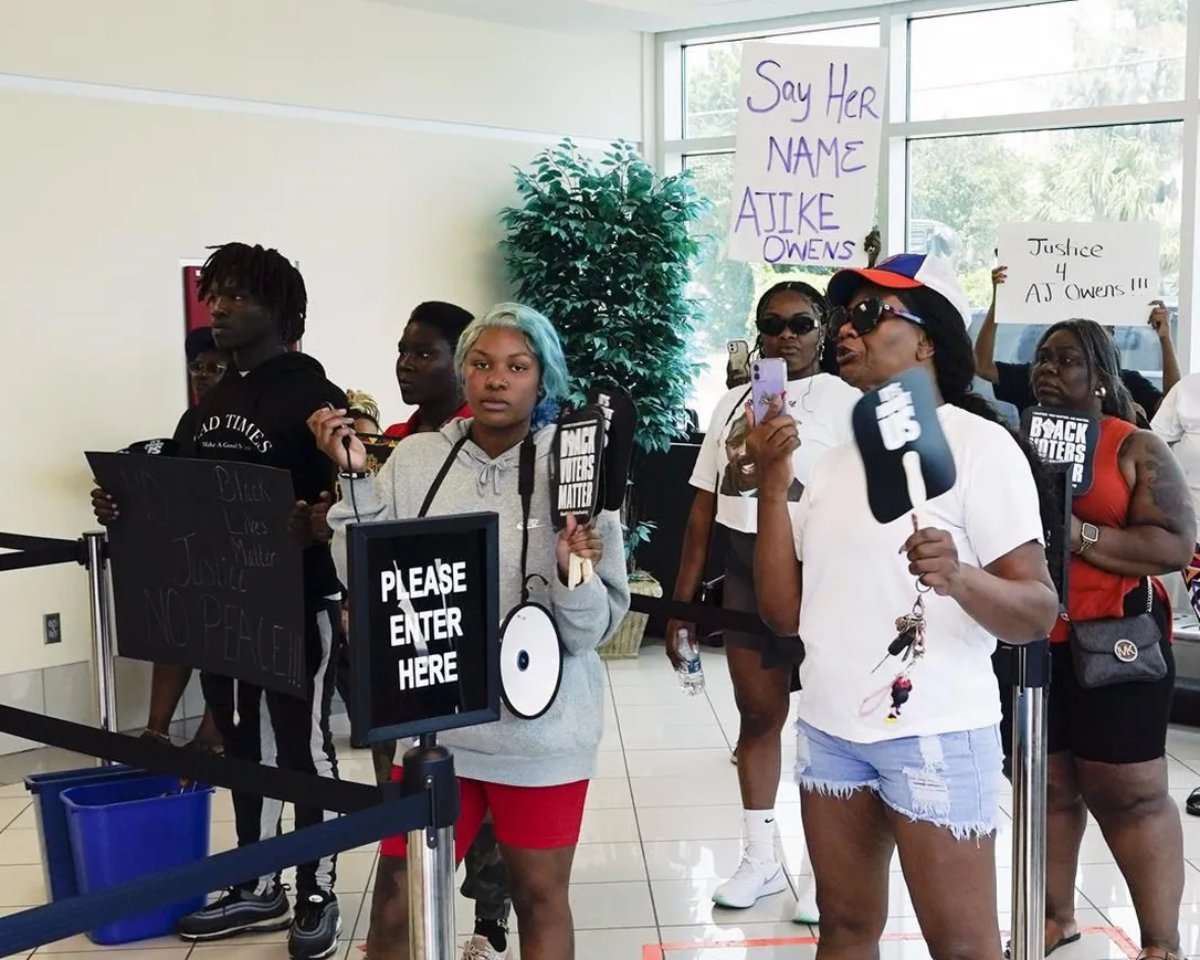 Protesters gather in the lobby of the Marion County Courthouse, Tuesday, June 6, 2023, in Ocala, demanding the arrest of a woman who shot and killed Ajike Owens, a 35-year-old mother of four, last Friday night, June 2. Authorities came under intense pressure Tuesday to bring charges against a white woman who killed Owens, a Black neighbor, on her front doorstep, as they navigated Florida’s divisive stand your ground law that provides considerable leeway to the suspect in making a claim of self defense.