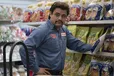 This image released by Searchlight Pictures shows Jesse Garcia in a scene from "Flamin' Hot," a tale of how a Mexican American janitor came up with the idea for Flamin’ Hot Cheetos.