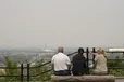 A group of tourists look east from a lookout on Mount Royal in Montreal on Monday, June 5, 2023. As wildfires continue to rage in Quebec and B.C. the smoke is blanketing cities and communities far away from the blazes and triggering air quality alerts.
