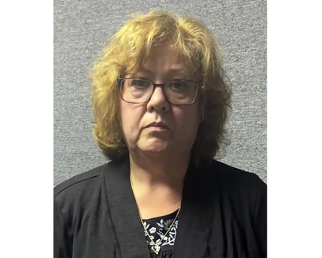 This booking image provided by the Marion County Sheriff’s Office shows Susan Lorincz, center, after her arrest in Ocala, Fla., Tuesday, June 6, 2023. Lorincz is accused of fatally shooting her neighbor, Ajike Owens, a Black mother of four.