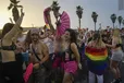 People dance during the annual Pride Parade in Tel Aviv, Israel, Thursday, June 8, 2023.