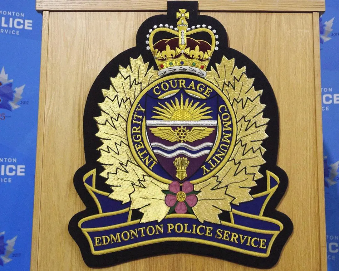 An Edmonton Police Service logo is shown at a press conference in Edmonton, Oct. 2, 2017. A self-styled spiritual leader and his wife are facing additional charges for alleged sexual assaults between 2012 and 2019.
